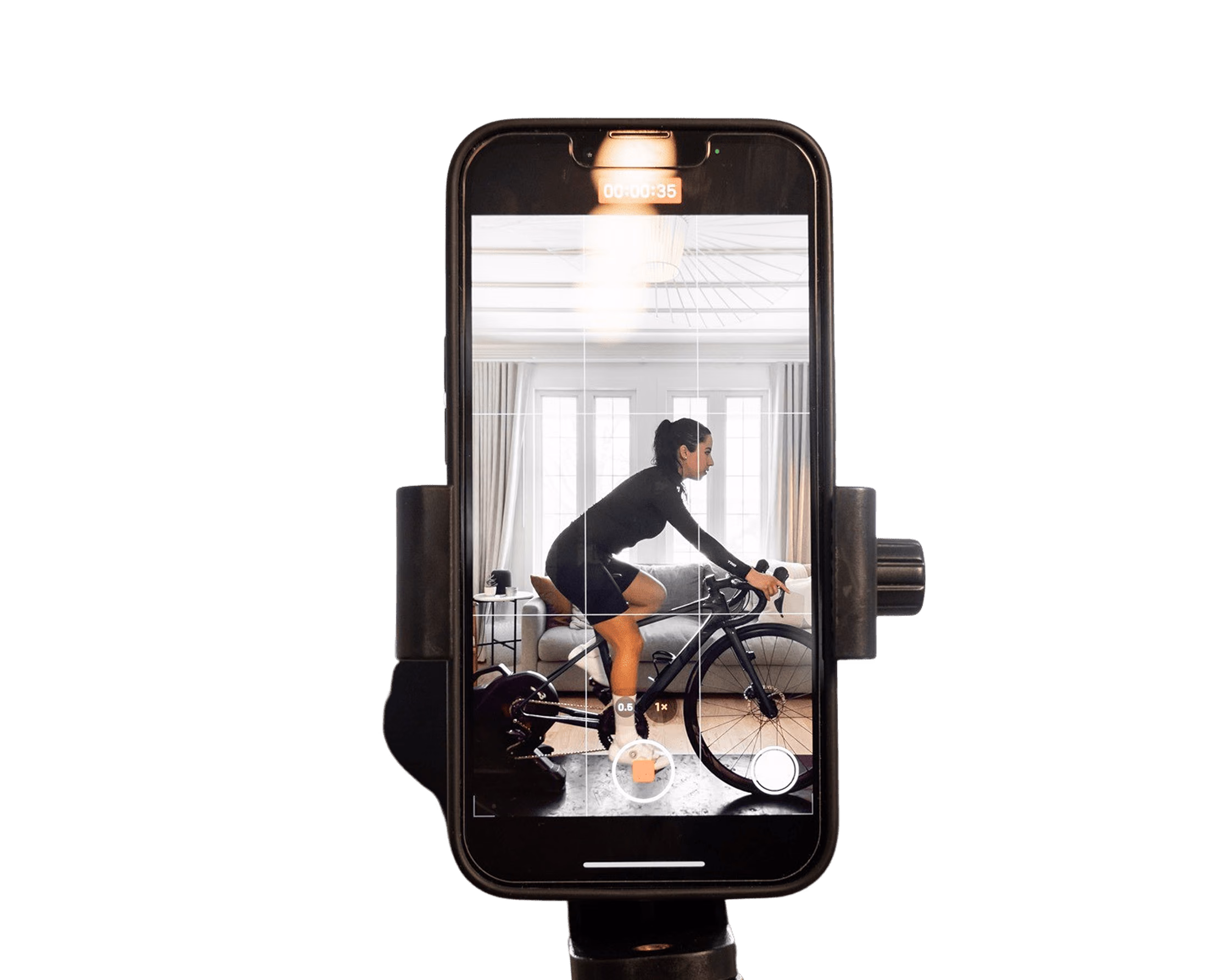 Smartphone recording a cyclist's riding posture for automated AI-powered analysis in a custom fitness app.